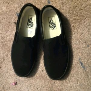 All black slip on vans
